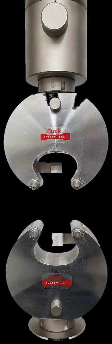 Briquette grips holding a moulded briquette specimen